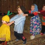 Children participate in a dramatization game based on the fairy tale “Turnip”